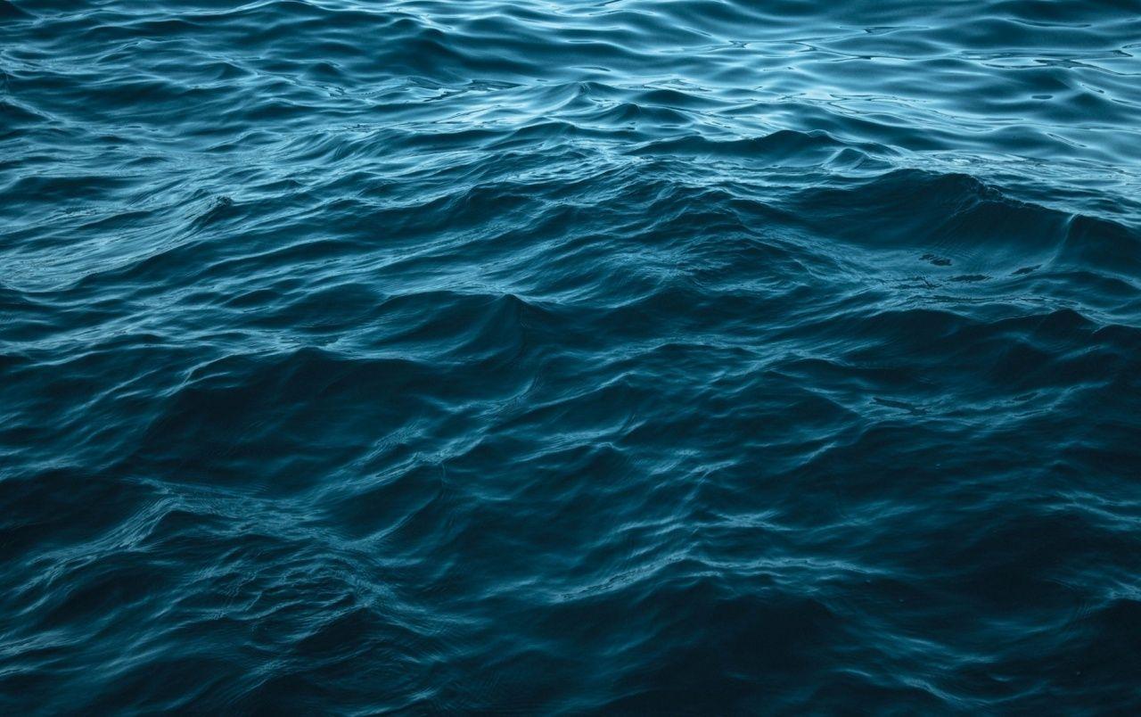 Deep blue ocean waves representing Water element